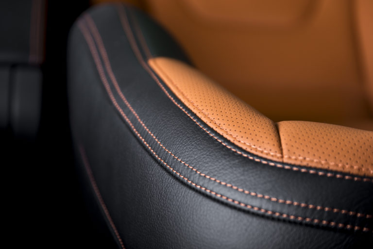 Modern sport car  black leather interior. Part of  leather car seat details.